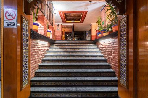 a set of stairs leading up to a building at Hotel Benedicta in Mexico City