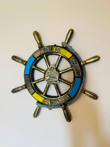 a blue and yellow badge on a white background at Royal Apartment Sea view by Kaliakria in Topola