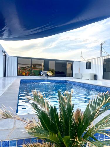 a swimming pool in the middle of a house at Luxury Farm with Swimming Pool and BBQ in Al Rahba