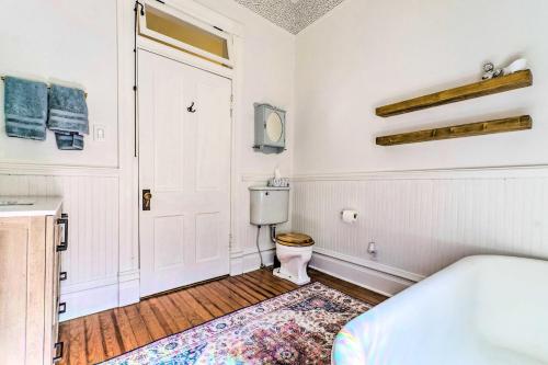 a bathroom with a toilet and a sink and a tub at Historic Home Near Downtown Little Rock! in Little Rock