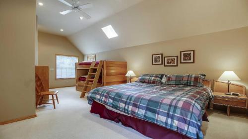 a bedroom with a bed and a desk at Mt. Hood 06 in Sunriver