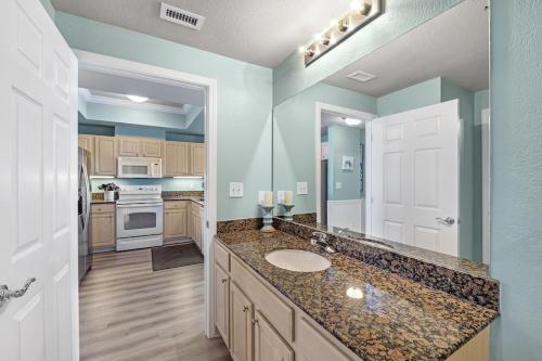 a kitchen with a sink and a counter top at Crystal Tower Unit 908 in Gulf Shores