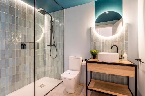 a bathroom with a toilet and a sink and a shower at CHARMING LOFT IN RUZAFA, SOHO b2 in Valencia