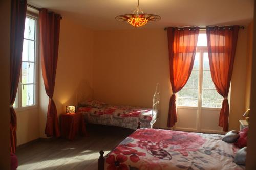 Ένα ή περισσότερα κρεβάτια σε δωμάτιο στο Le Clos de la Salamandre