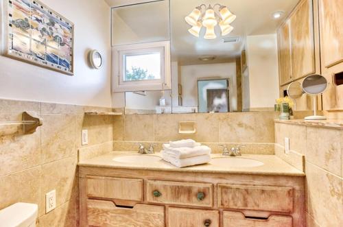 a bathroom with a sink and a mirror at Baybarlyn home in Captiva