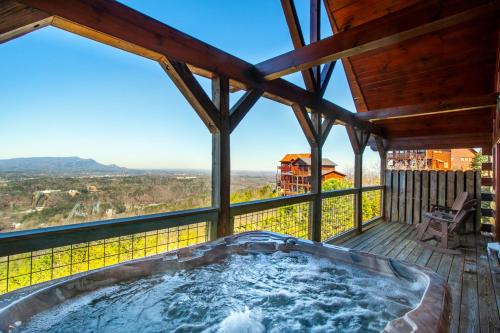 a hot tub on the deck of a house at A Shining Starr Beautiful MTN Views Hot Tub in Sevierville