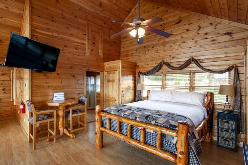 a bedroom with a bed and a flat screen tv at A Shining Starr Beautiful MTN Views Hot Tub in Sevierville