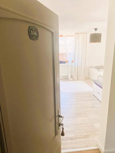 a door with a sign on it in a room at Hotel SEVERKA in Zákopčie