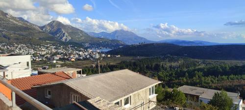 a view of a town with mountains in the background at Apartmani Seaview in Sutomore