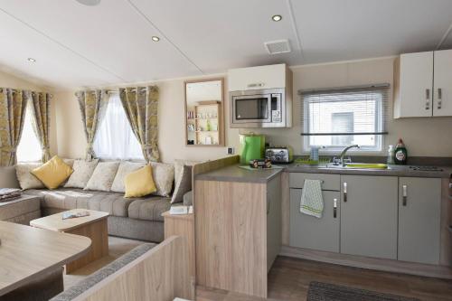 a small kitchen and living room in a caravan at Benamara in Ryde
