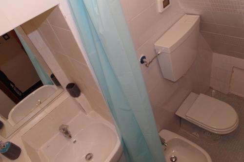 a bathroom with a toilet and a sink and a shower at Ca Du Grifun in Vernazza