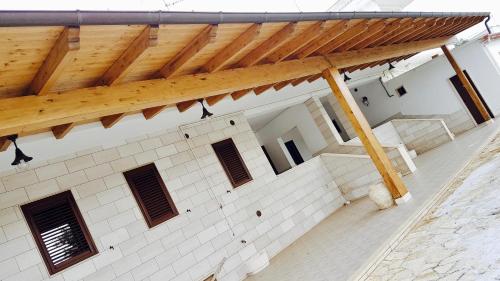 an overhead view of a building with a wooden roof at B&B 5 Lune in Alberobello