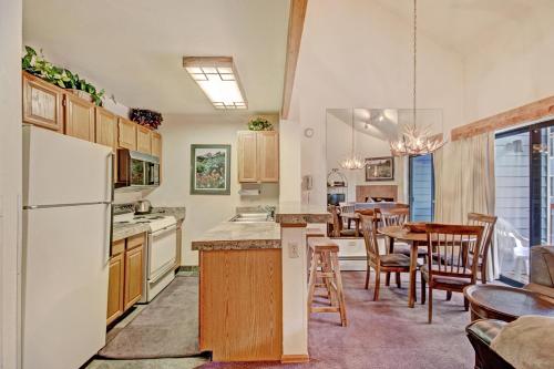 a kitchen and dining room with a table and chairs at Studio Apartment in Breckenridge