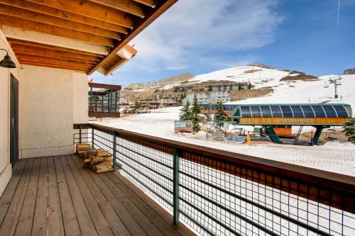 a balcony with a view of a snow covered mountain at View Of Mt Crested Butte- 1 Br Condo in Crested Butte