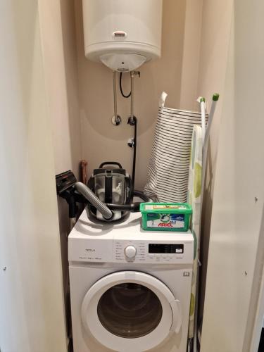 a washing machine with a camera on top of it at Beograd na vodi - BW AURORA LUXURY in Belgrade