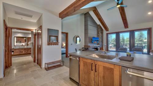 a kitchen with a sink and a large window at Luxury Residence - Gondola Across The Street Condo in South Lake Tahoe