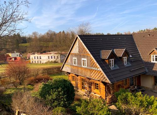 an overhead view of a house with a black roof at Penzion Na Stodolci in Chřibská