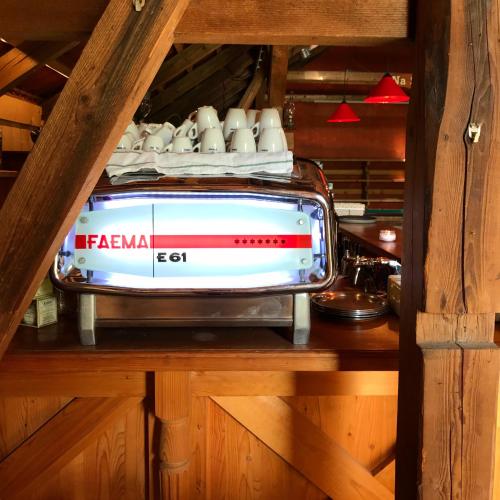 a stove sitting on top of a wooden shelf at Penzion Na Stodolci in Chřibská