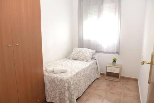 Posteľ alebo postele v izbe v ubytovaní Apartamento Elena - Sólo Familias y Parejas