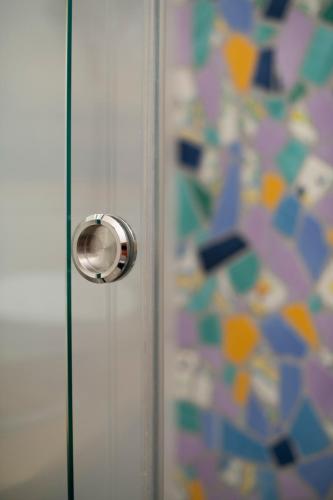 a door with a metal door knob on a wall at Strit strit centro storico in Amalfi
