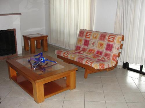 a living room with a couch and a coffee table at Las Casitas Tepoztlán in Tepoztlán