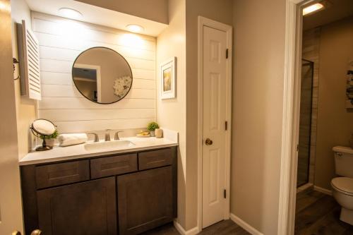 a bathroom with a sink and a mirror at 359 Tarpon Blvd in Fripp Island