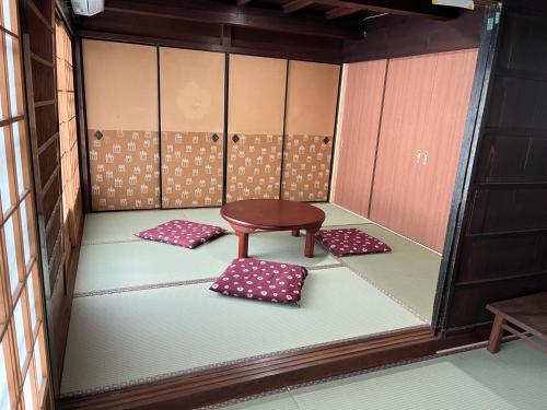 a room with a table and two mats in it at Yoshino-gun - House - Vacation STAY 90749v in Kami-ichi