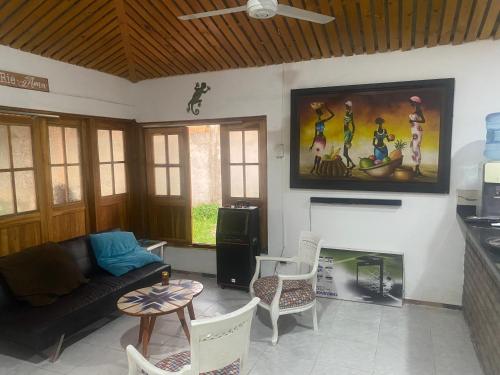 a living room with a couch and a fireplace at Casa de descanso acacias meta in Acacías