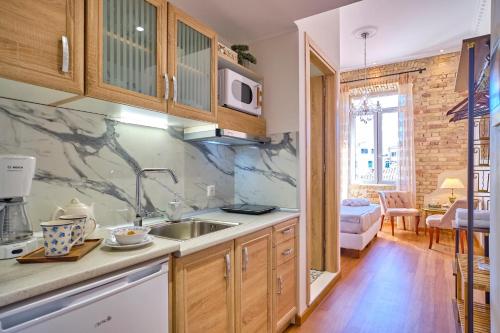 a kitchen with a sink and a counter top at Anesis Studios Old Corfu Town in Corfu