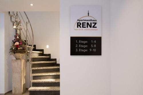 a stairway with a sign on the wall at Apartmenthaus Renz in Aalen