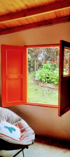 a window in a room with a bed next to it at La jinquita in La Unión