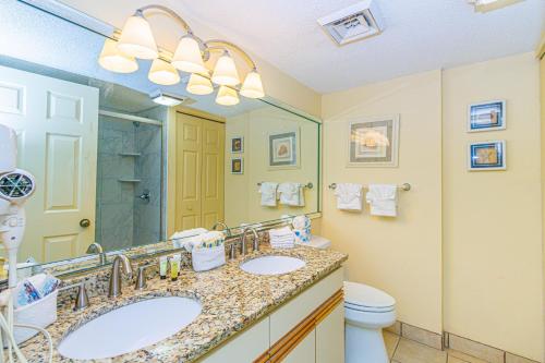 a bathroom with two sinks and a toilet at Beach Colony Resort Unit 1405 - Beautiful Oceanfront Condo - 1 bedroom, 1 bath - Perfect for 6! in Myrtle Beach