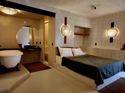 Outro Beach Hotel Cumbucoにあるベッド