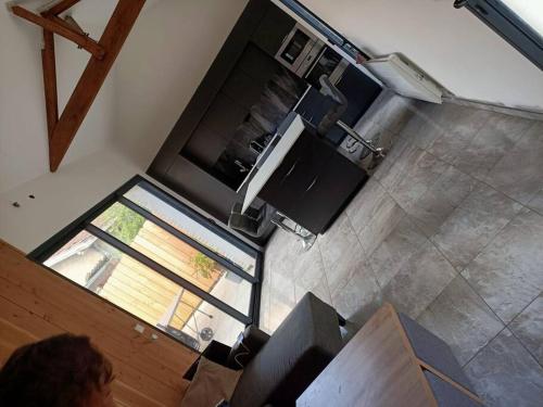an overhead view of a living room with a flat screen tv at T3 refait à neuf, patio, wifi et plage in Arcachon