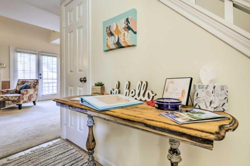 a room with a table with a book on it at Lovely Norwich Villa, On Golf Course with Amenities! in Norwich