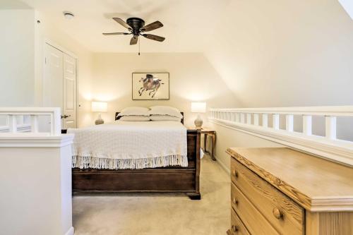 a bedroom with a bed and a ceiling fan at Lovely Norwich Villa, On Golf Course with Amenities! in Norwich
