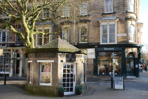 a shop on a street in front of a building at Springdale Guest House in Harrogate