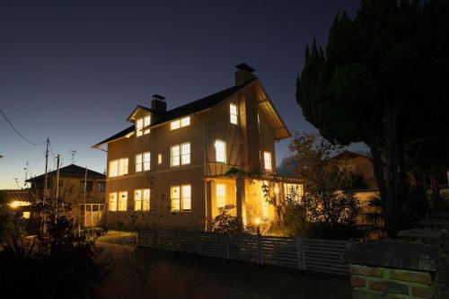 a large house at night with its lights on at Waterhouse Memorial - Vacation STAY 14310 in Omihachiman