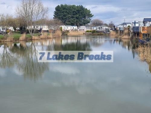 a body of water with the words lakes breaks at 7 Lakes Breaks at 7 Lakes Country Park-WF73 in Crowle