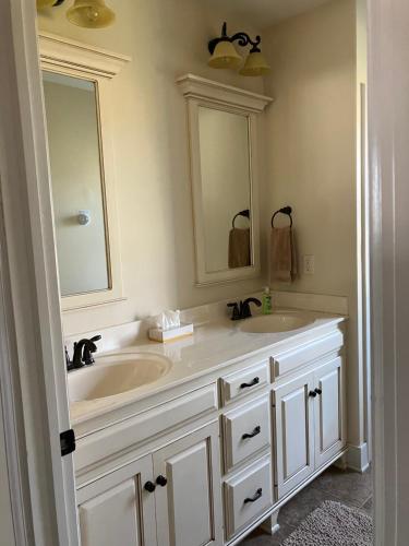 a bathroom with a sink and a mirror at Farmhouse at Landyshade in Lancaster