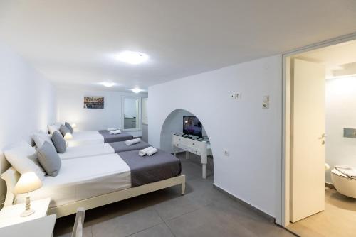 Letto o letti in una camera di Achilleas Pension