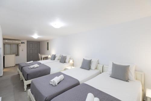 Letto o letti in una camera di Achilleas Pension