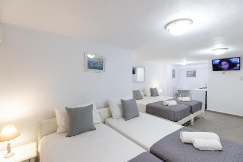 Letto o letti in una camera di Achilleas Pension