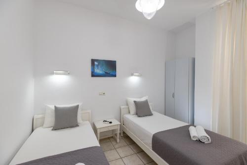 Letto o letti in una camera di Achilleas Pension
