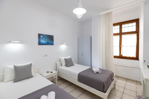Letto o letti in una camera di Achilleas Pension