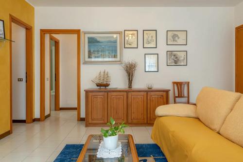a living room with a couch and a table at CASTLE&LAKE in Rezzonico