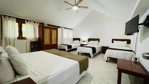 Postel nebo postele na pokoji v ubytování Hotel B&B - 5th Avenue