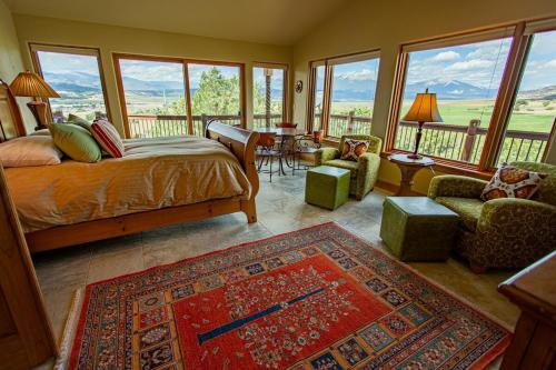 a bedroom with a bed and a balcony with a view at Vista Grande 1 Mi To Salida 3 Or 4 Bdrm Options in Salida