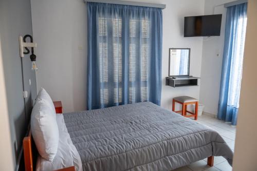 Postel nebo postele na pokoji v ubytování Hotel Theoxenia