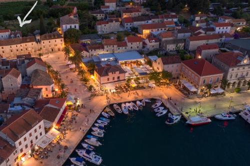 an aerial view of a town with boats in the water at Revelin Hvar in Stari Grad